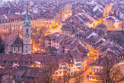 Illuminated buildings in town at night