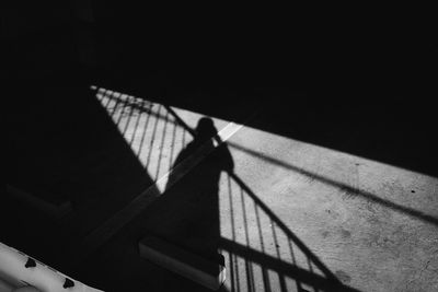 High angle view of person walking on staircase