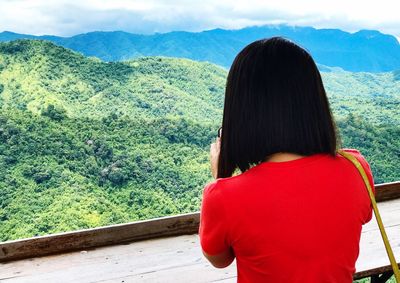 Rear view of woman looking at mountains