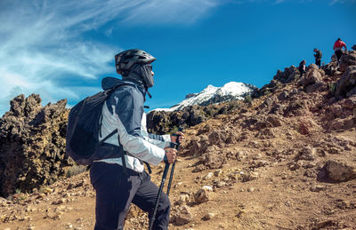 Rear view of man standing on mountain