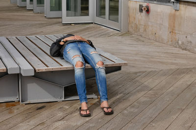 Low section of man sitting on floor