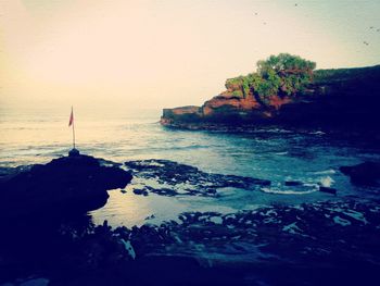 Scenic view of sea against sky at sunset