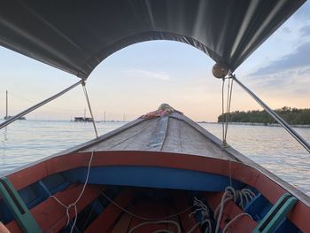 Sailboat sailing in sea against sky