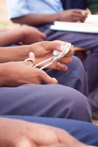 Close-up of people holding hands