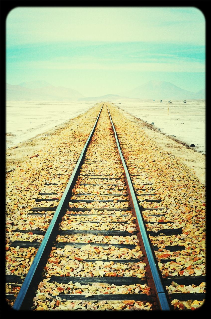 transfer print, the way forward, auto post production filter, horizon over water, sea, sky, diminishing perspective, beach, tranquil scene, tranquility, sand, vanishing point, scenics, nature, beauty in nature, railing, outdoors, cloud, water, sunlight