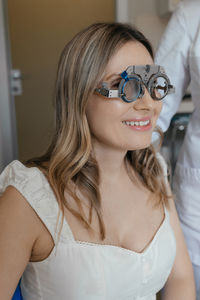 Portrait of young woman wearing sunglasses