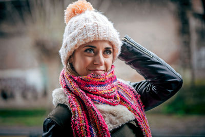 Portrait of smiling woman in snow