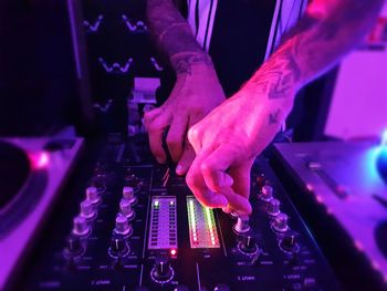 Midsection of woman using smart phone at night