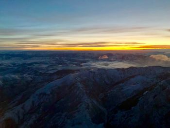 Scenic view of landscape against sky during sunset