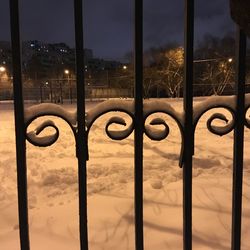 Close-up of metal fence during winter