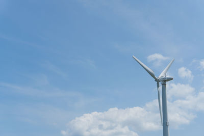 Low angle view of wind turbine against sky