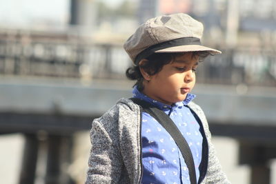 Boy with eyes closed standing at beach