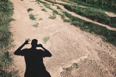 Shadow of man on field