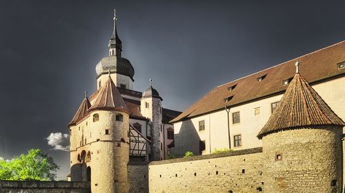 Low angle view of fortress marienberg against sky