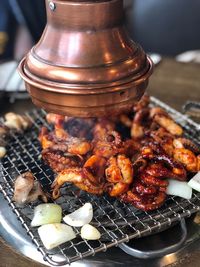 High angle view of meat on barbecue grill