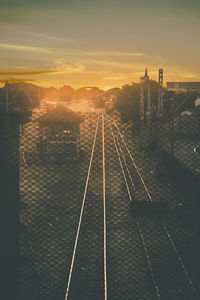 High angle view of railroad tracks against sky during sunset