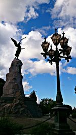 Statue of liberty against cloudy sky