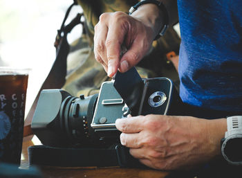 Midsection of man photographing