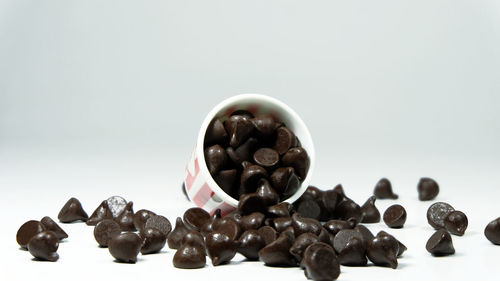 Close-up of coffee beans against white background