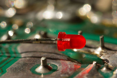 Close-up of red telephone on table