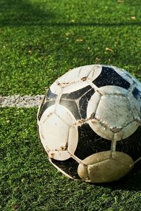 Close-up of soccer ball on field