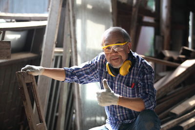 Portrait of smiling man standing outdoors