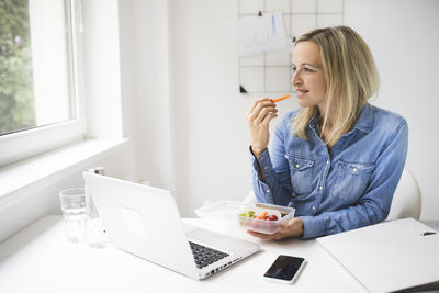 Young woman using mobile phone