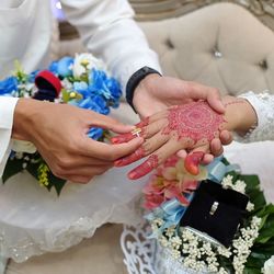 Close-up of couple holding hands