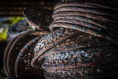 Close-up of stacked wicker baskets for sale