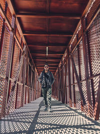 Full length of man on footbridge