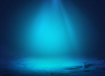 Abstract image of illuminated blue sea during winter at night