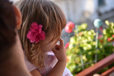 Close-up of girl picking nose