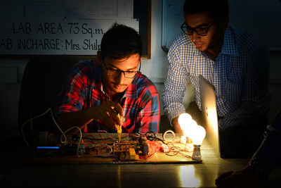 Engineers repairing mother board