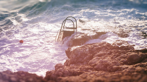 Waves splashing on rocky shore