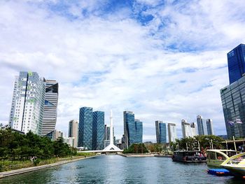 City skyline against cloudy sky