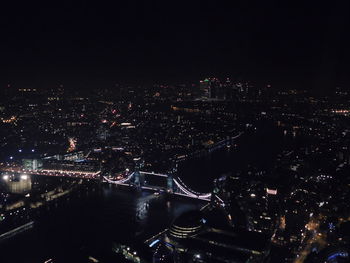 High angle view of illuminated city buildings at night