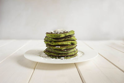 High angle view of pancakes in plate on table