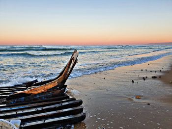 Scenic view of sea against clear sky during sunset