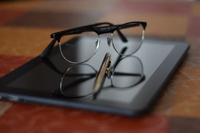Close-up of eyeglasses on table