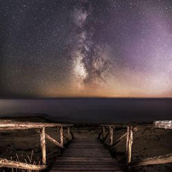 Scenic view of sea against sky at night