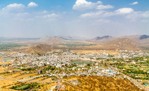 Aerial view of townscape against sky