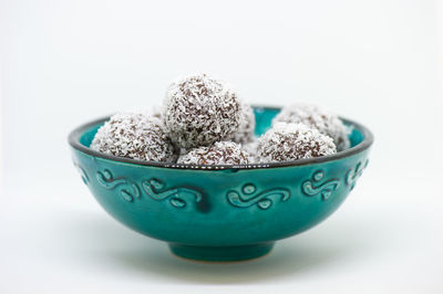 Close-up of food in bowl against white background