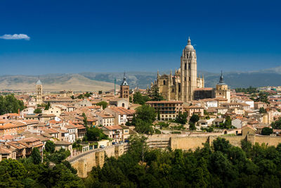 High angle view of townscape against blue sky