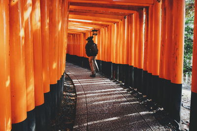 Rear view of man in corridor