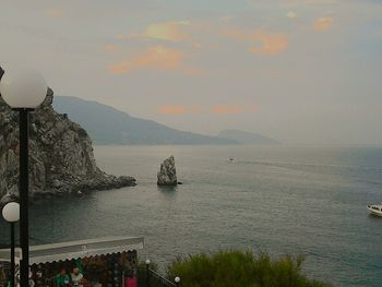 Scenic view of sea against cloudy sky