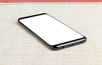 High angle view of smart phone on table