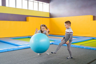 Full length of a boy with ball