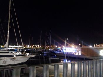 Boats moored at harbor