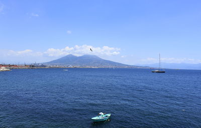 Sailboat in sea against sky