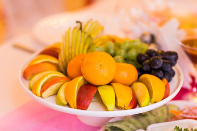 Close-up of fruits in plate on table